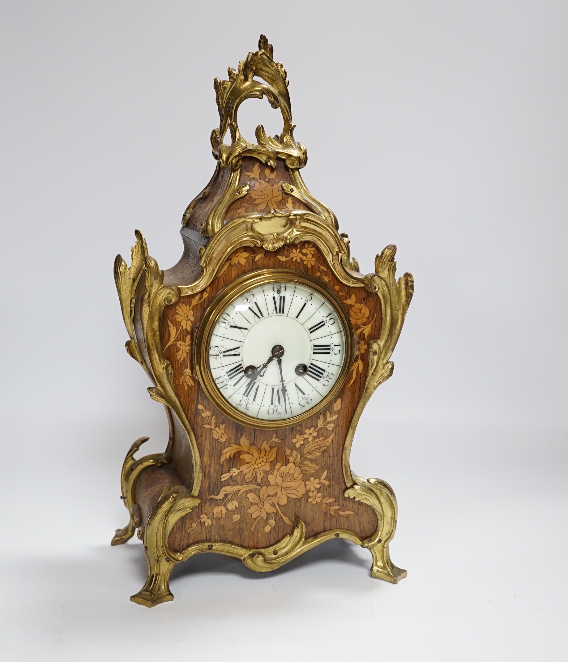 A French gilt metal mounted rosewood and floral marquetry mantel clock. 40cm